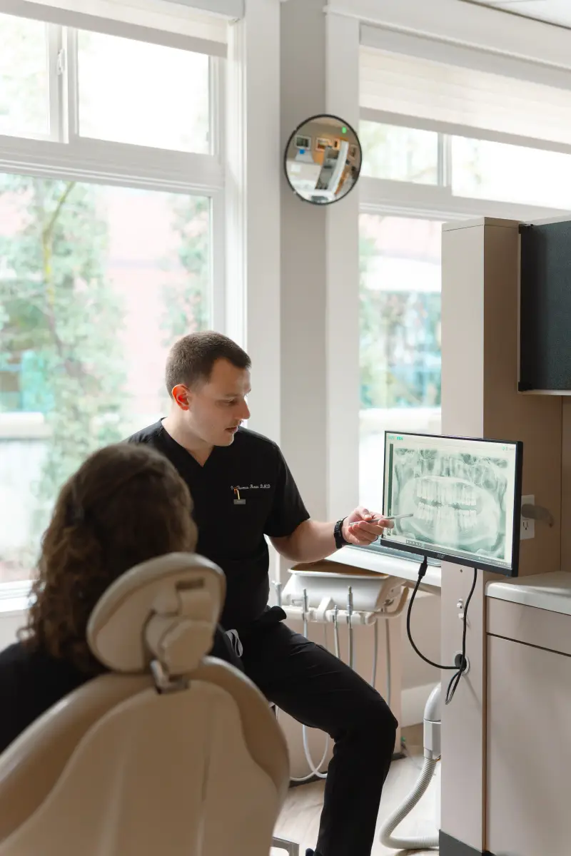 Dentist explaining X-ray to patient